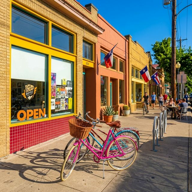 Colorful bicycles parked outside an Oak Cliff storefront